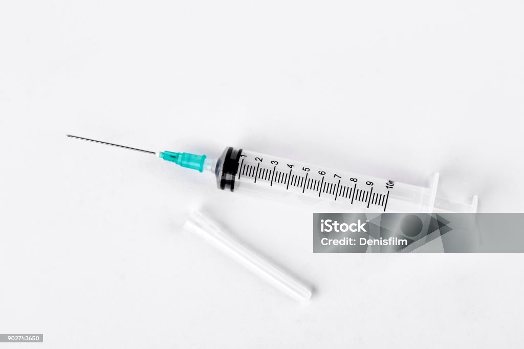 Empty syringe on white background. Empty syringe on white background. Plastic medical syringe isolated on white background. Syringe Stock Photo