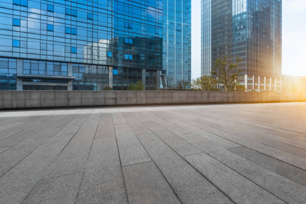 istock Empty brick road front of office building at night 902745988
