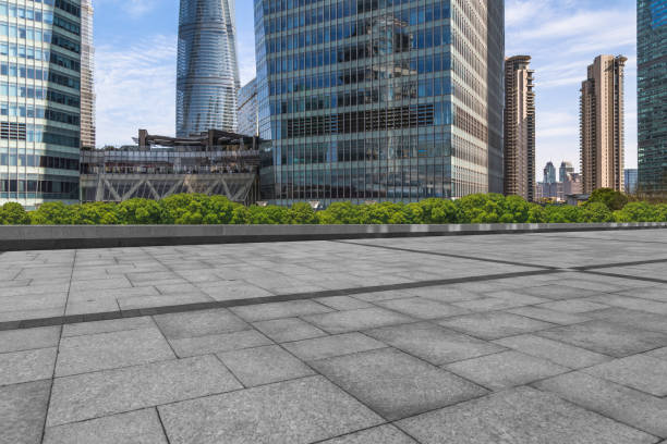 istock Empty brick road front of office building at night 902746258