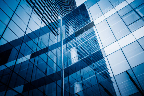 Modern office building Glass - Material, Metal, Wall - Building Feature, Building Exterior, Built Structure blue business stock pictures, royalty-free photos & images