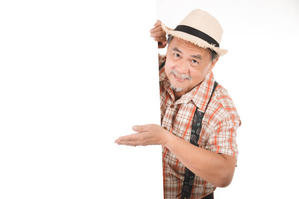 istock Senior man wearing a plaid shirt making 902746494