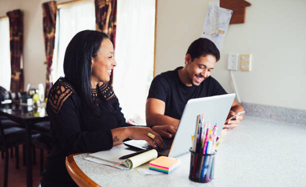 istock Couple managing small business from home. 902746636