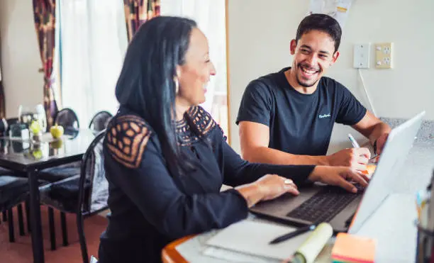 couple at home discussing the success of their business.