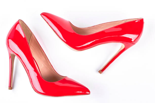 istock Woman red lacquered shoes on heels. 902747038