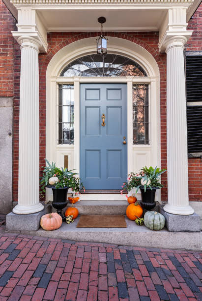 front blue door, front view of a house Exterior of a house with seasonal decor with a blue door blue front door stock pictures, royalty-free photos & images