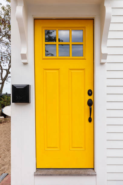Front door, bright yellow front door stock photo