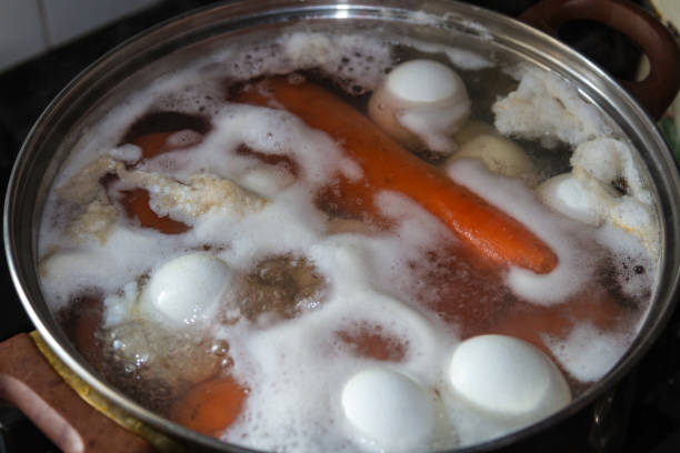 istock Cooking carrots and eggs in a pan 902754322