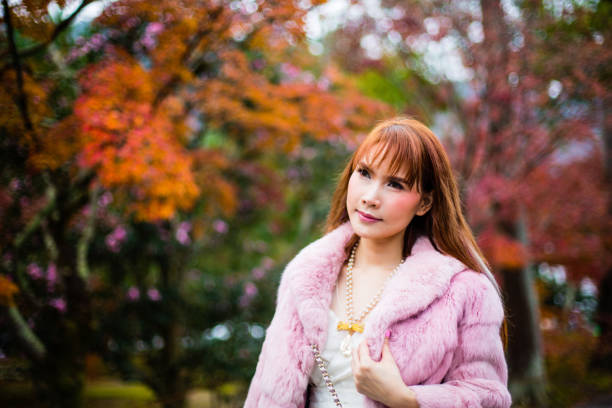 istock Asian woman in autumn 902754522