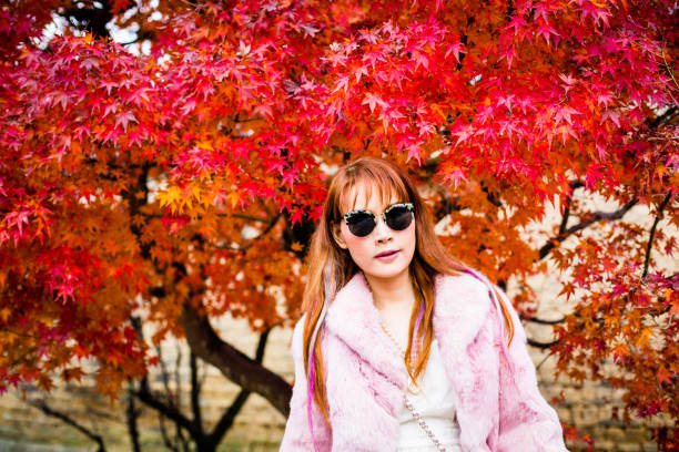 istock Asian woman in autumn 902754528