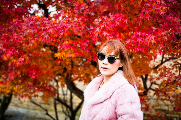istock Asian woman in autumn 902754530