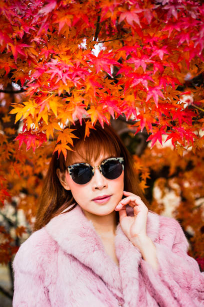istock Asian woman in autumn 902754550