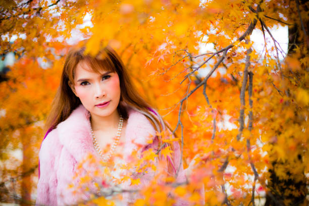 istock Asian woman in autumn 902754560