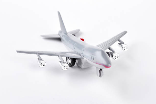 istock Grey toy air plane on white background. 902756878