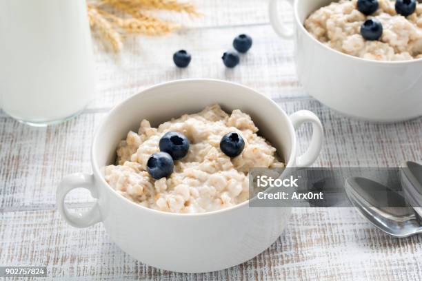 Oatmeal Porridge With Blueberries In White Bowl Stock Photo - Download Image Now - Blueberry, Porridge, Oatmeal