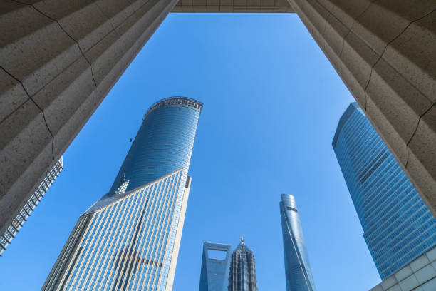 istock Low angle view of modern metallic skyscrapers 902758192