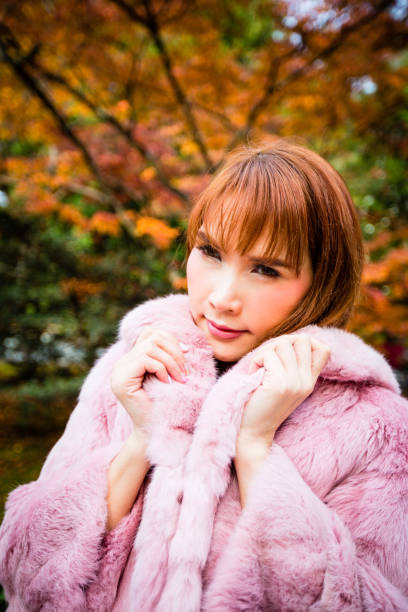 istock Asian woman in autumn 902760594