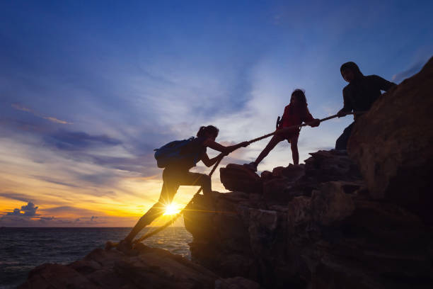 istock Silhouette of hikers. 902760872