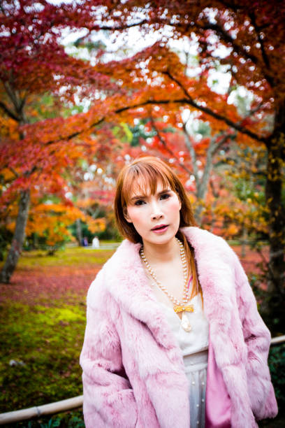 istock Asian woman in autumn 902764380