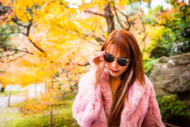 istock Asian woman in autumn 902764436