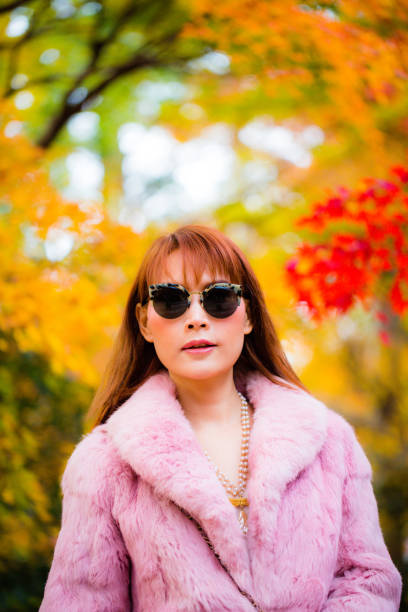 istock Asian woman in autumn 902764440
