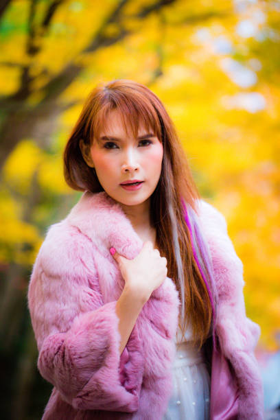 istock Asian woman in autumn 902764452