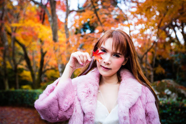istock Asian woman in autumn 902764466