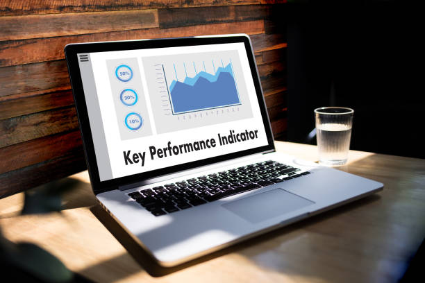 istock KPI acronym (Key Performance Indicator) Business team hands at work with financial reports and a laptop 902766840