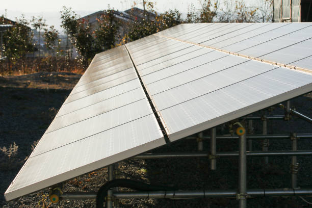 istock Solar  power panels for innovation green energy for life with mountains 902767962