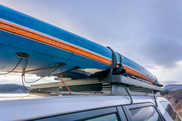 istock stand up paddleboard on roof racks of suv 902774072