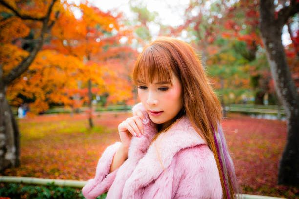 istock Asian woman in autumn 902774132