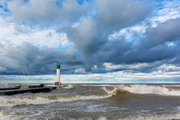 istock Lighthouse and Pier in Stormy Weather - Lake Huron 902787114