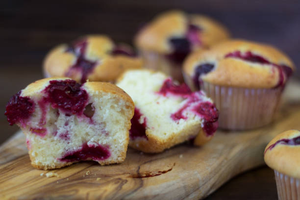 istock Muffins with cherry and chocolate on a wooden board 902789902