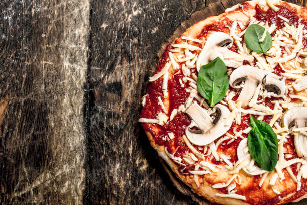 istock Preparation of pizza with natural ingredients. 902790390