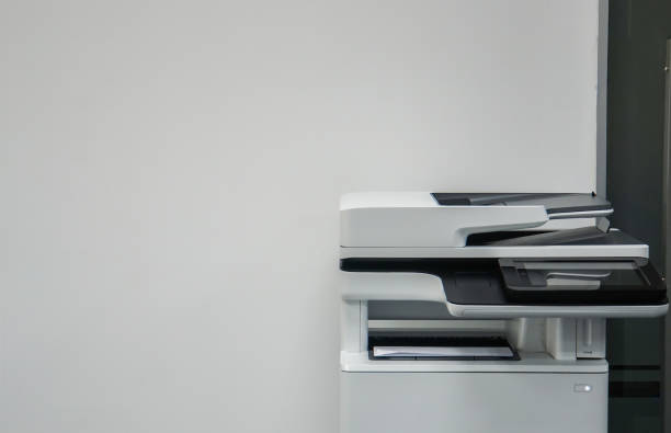 istock multifunction printer in office for printing, scanning, copying and sending fax 902794088