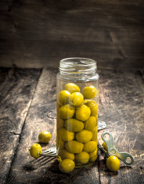 istock Pickled olives in glass jar. 902794276