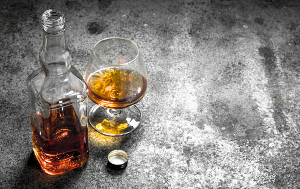 istock French cognac in glass. 902794634