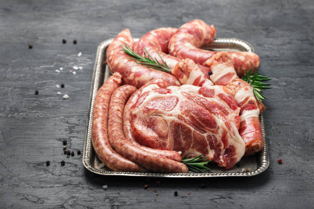 istock Set meat products for cooking on grill on tray. Copy space 902801308