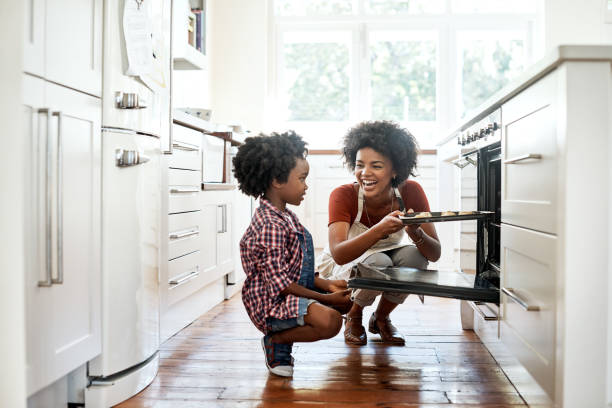 Shot of a mother and son baking together in the kitchen