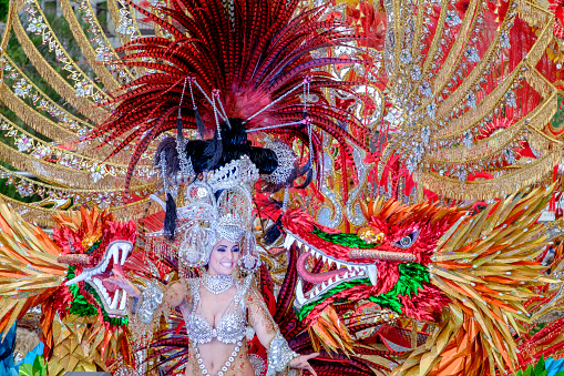 Las Palmas de Gran Canaria, Spain - February 17 2024: Carnival queen greets the public  at grand carnival procession