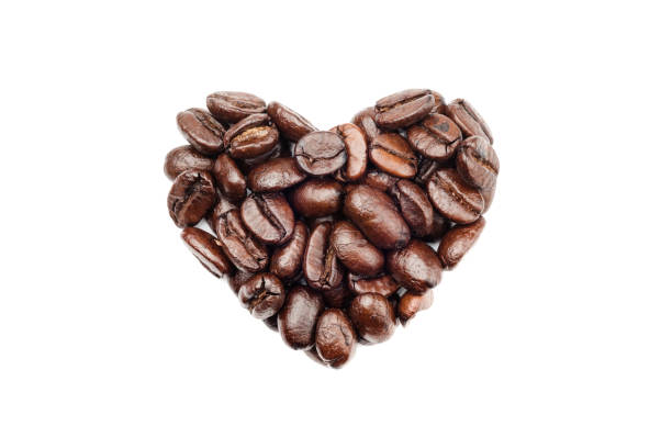 istock Coffee beans in heart shape isolated on white background 902812392