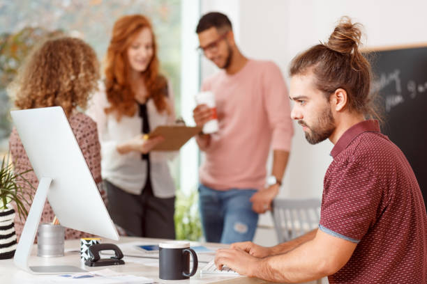 istock Focused businessman working at desk 902813338