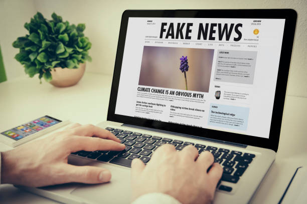 istock laptop on tabletop fake news 902819296