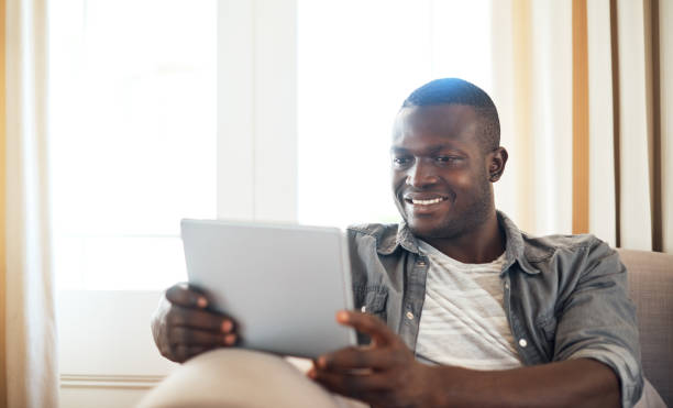 istock Catching up on my favorite tv show 902820022