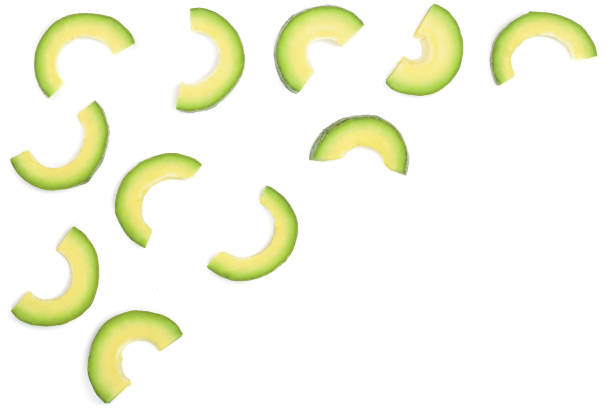 istock slices of avocado isolated on white background with copy space for your text. Top view. Flat lay 902820286