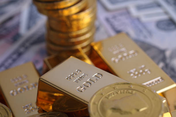 istock Gold coins with gold ingot 902826590