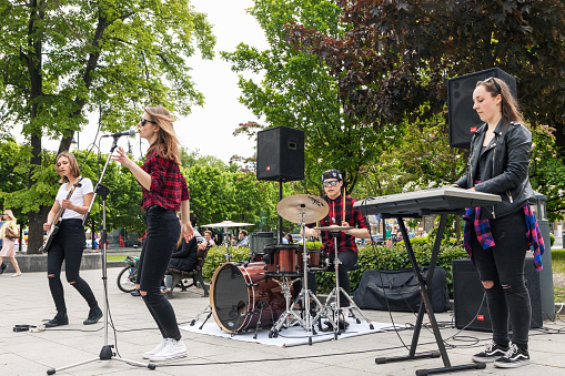 Vilnius, Lithuania - May 21, 2016: Teenager rock music band performing on the street in Vilnius, Lithuania