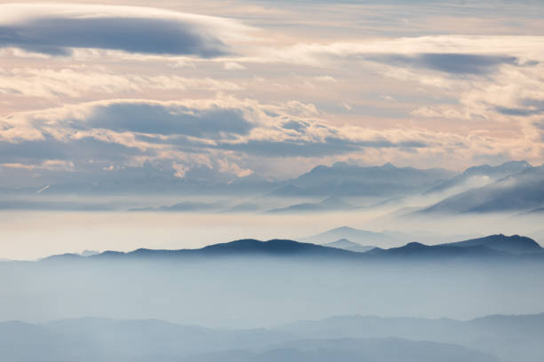 istock Foggy mountain silhouette landscape 902826854