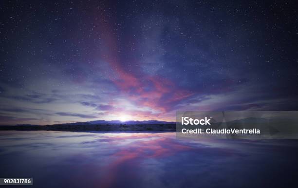 Idyllic Sunrise In The Sky Reflecting On Water Stock Photo - Download Image Now - Night, Sky, Cloud - Sky