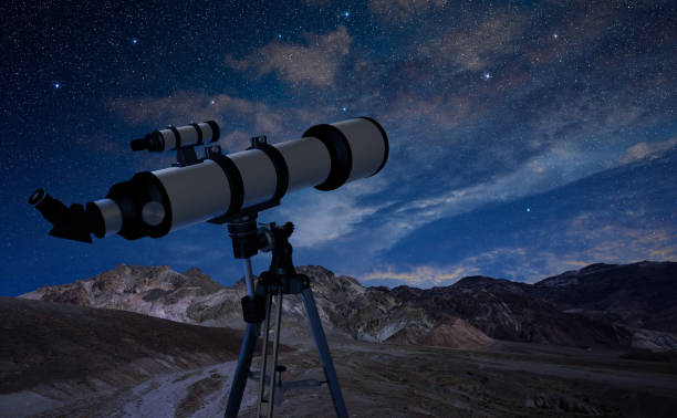 istock telescope pointing at the night sky 902831830