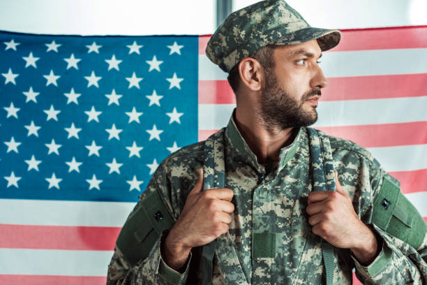 istock soldier in military uniform 902835420